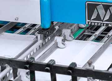 a notebook printing machine is printing the inner pages