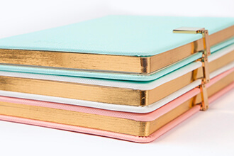 3 notebooks with custom foil edge spraying