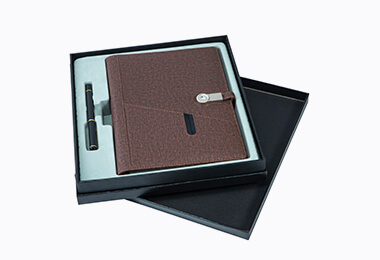 assembled notebook with a pen