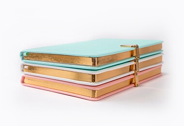 a series of finished notebooks